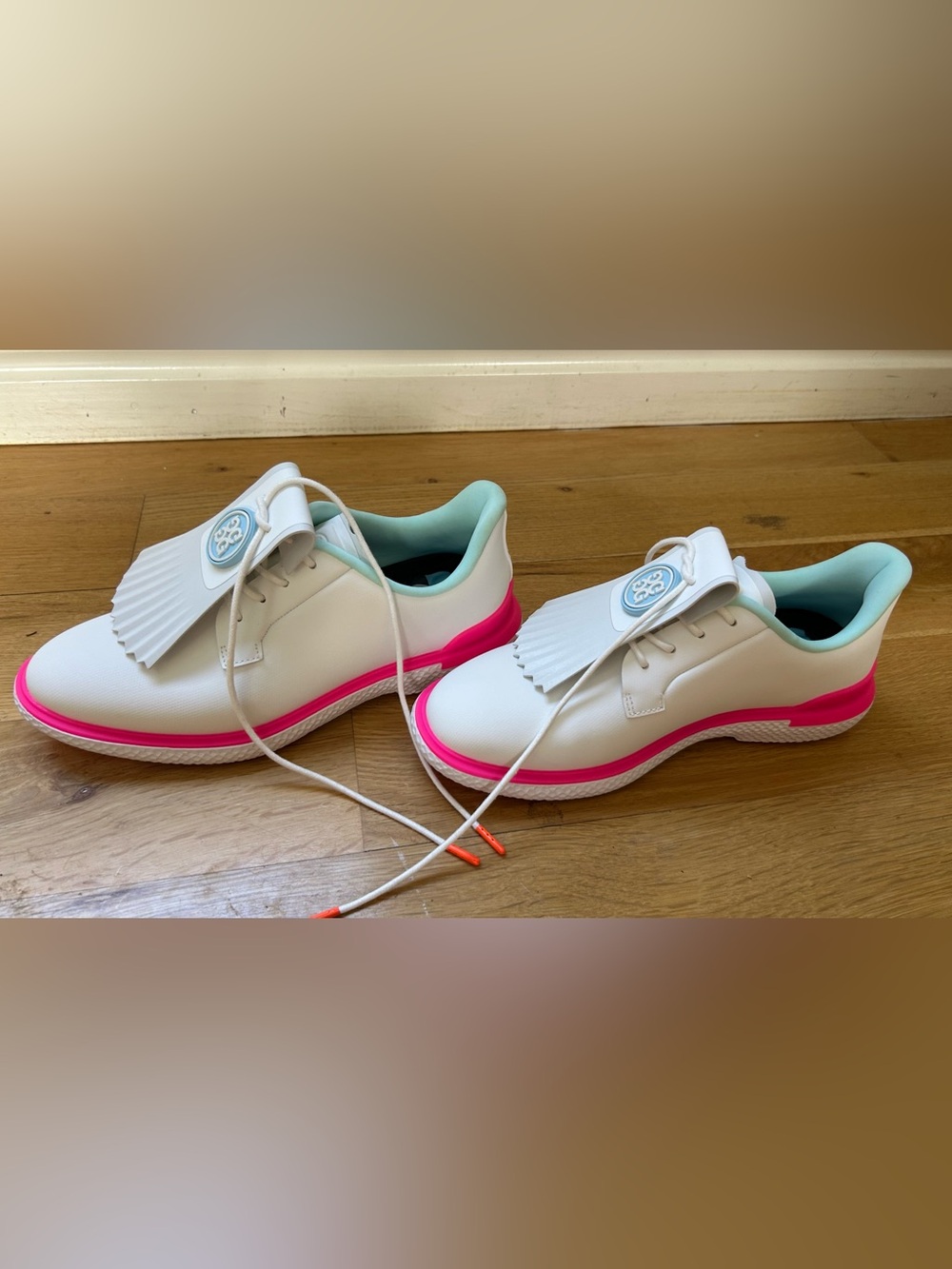 G/FORE White golf shoe with Hot Pink Trim and Mint Interior